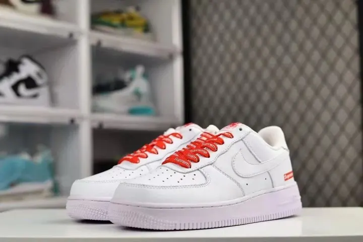 Supreme White Low-Top Sneakers with Red Logo Laces