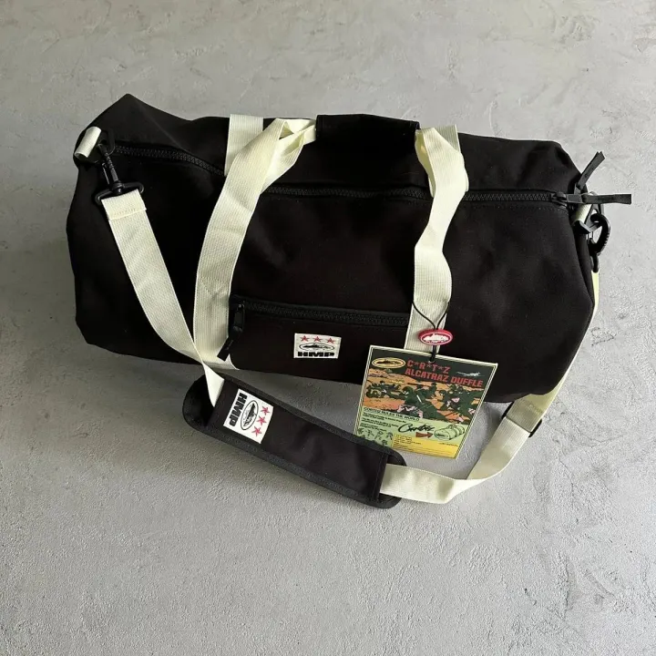 Corteiz Black Alcatraz Duffle Bag with Cream Straps