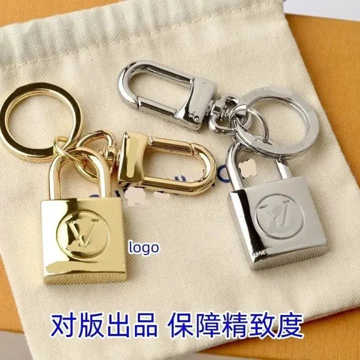 Louis Vuitton Padlock-tassenbedelset in goud en zilver