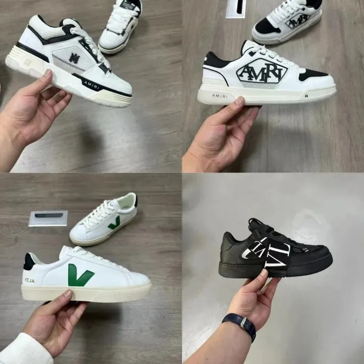 AMIRI schwarze und weiße Low-Top-Sneaker mit Logo