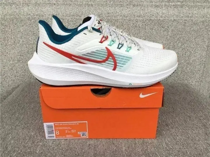Nike White Running Sneakers with Red Swoosh and Teal Collar